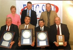 The 2004 ECAC-SIDA award winners and their presenters. Front (L-R): Joe O’Gorman (Trentonian), Greg Wright (Millersville), Jones (Skidmore), Jay Waldman (ECAC-SIDA Counsel). Back: Ann King (Sage Colleges), Steve McCloskey (Mansfield), Roger Crosley (ECAC-SIDA).